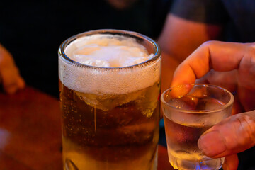 cheers with beer and soju
