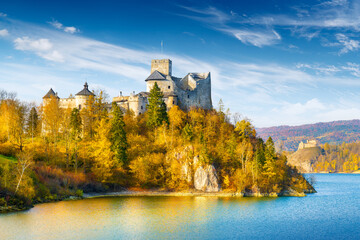 Beautiful view of the castle in Niedzica on a sunny day with the Tatra Mountains in the background, Poland