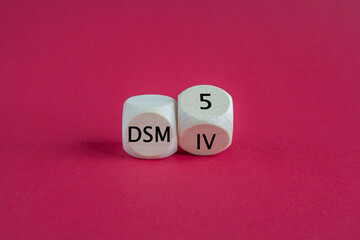 Turned a cube and changes the expression 'DSM IV' to 'DSM 5'. Symbol for the update of DSM (Diagnostic and Statistical Manual of Mental Disorders) guideline. Beautiful red background.