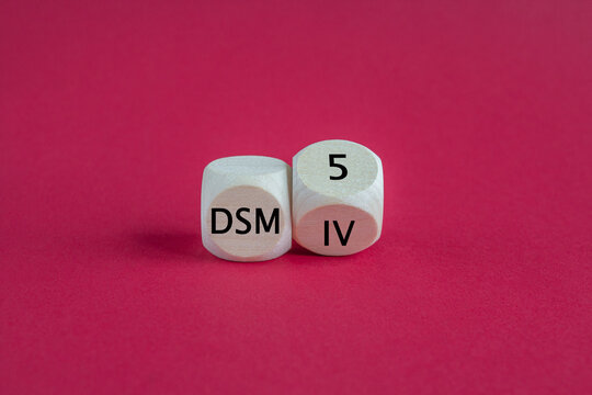 Turned a cube and changes the expression 'DSM IV' to 'DSM 5'. Symbol for the update of DSM (Diagnostic and Statistical Manual of Mental Disorders) guideline. Beautiful red background.
