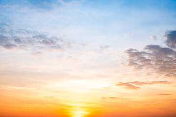 Fototapeta premium Beautiful , luxury soft gradient orange gold clouds and sunlight on the blue sky perfect for the background, take in everning,Twilight, Large size, high definition landscape photo