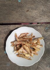 Fried salted fish on the plate
