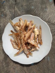 Fried salted fish on the plate