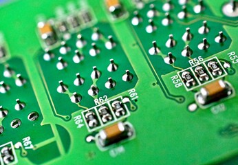 circuit board with electronic components close up image , technology concept