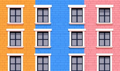 Fototapeta premium Colorful facade of a building with vibrant orange, blue, and pink sections, featuring large windows.