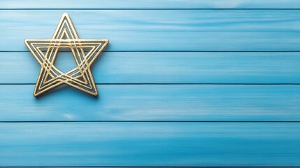 Naklejka premium Elegant golden Hanukkah star against a serene blue textured wall with ample space for personalization and celebration reflections