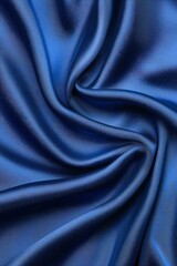 Obraz premium Elegant blue satin fabric texture, smooth and luxurious on a white background.