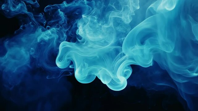 Blue ink swirls and dances in a dark liquid, creating an abstract pattern