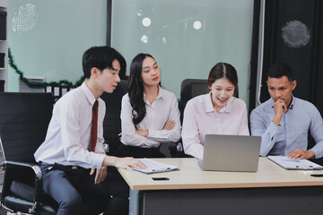 Entrepreneurs and business people conference in modern meeting room, happy multiracial coworkers have fun cooperating working together at office meeting, asian teamwork concept