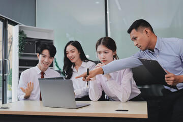 Entrepreneurs and business people conference in modern meeting room, happy multiracial coworkers have fun cooperating working together at office meeting, asian teamwork concept