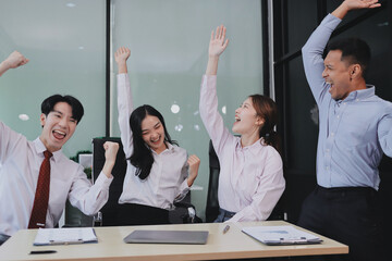 Group of business workers standing with hands together at the office