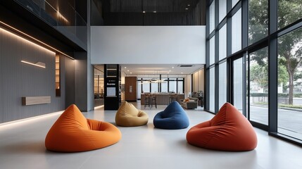 Modern office lobby interior with bean bag chairs, large windows, and a reception area in an open and minimalist design.