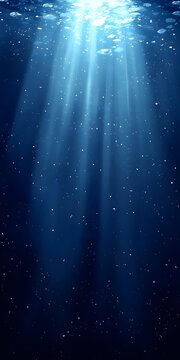 A serene underwater scene showcasing beams of sunlight piercing through deep blue waters, highlighting the tranquil beauty of the aquatic environment.