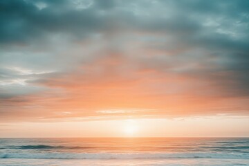 Obraz premium A serene sunset scene over the ocean on a cloudy day, perfect for travel or nature-themed projects. Beautiful simple AI generated image
