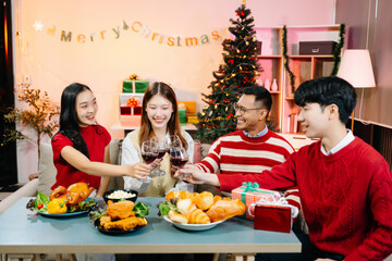 Holiday spirit with Asian friends exchanging gifts, sharing laughs, and enjoying a festive Christmas dinner