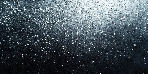 Rain of sparkling light against dark background. Abstract representation of snowflakes falling on water surface.