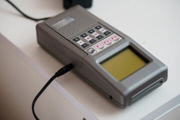 Vintage Electronic Device with Numeric Keypad and Display Screen