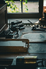 A container of documents on a dark wooden desk