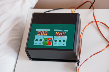 Digital Display Device with Dual Readouts and Control Buttons on a Minimalist Surface