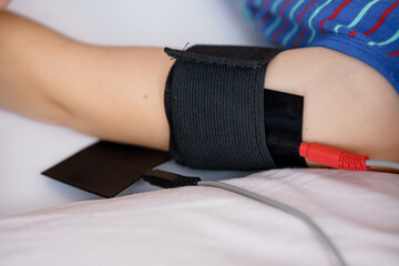 Medical Monitoring Equipment on Child's Arm During Procedure