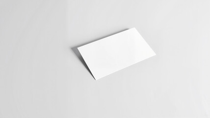 Blank white card on textured surface