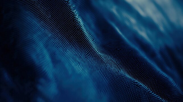 Close-up of textured blue fabric with subtle patterns and gradients.