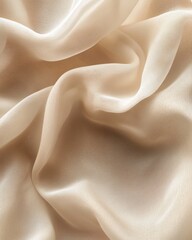 Obraz premium Soft beige silk fabric texture, elegant flowing drapery, perfect for backgrounds.