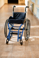 Empty Wheelchair on a Hospital Corridor