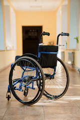 A Sturdy Blue Wheelchair in a Bright Indoor Space