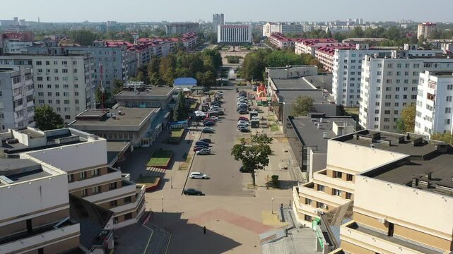 Bobruysk, Belarus - 08.31.2024: Drone flies over Bobruisk. Bobruisk city center in Belarus, panoramic view of the city from a drone from an altitude. The central shopping square of Bobruisk.