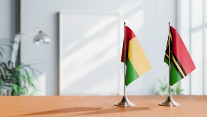 FLAGS OF GUINEA-BISSAU And VANUATU ON TABLE