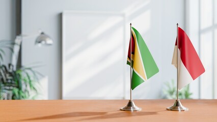 FLAGS OF GUYANA And INDONESIA ON TABLE