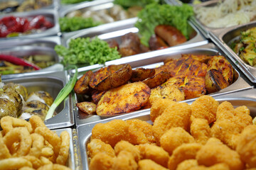 Various boiled, fried and deep-fried foods in fast food restaurant. Potatoes