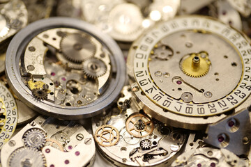 Old mechanical watches with gears and cogs. Watch or clock mechanisms