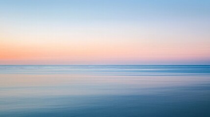 Fototapeta premium Abstract, dreamy, and peaceful seascape with a blurred horizon and soft pastel colors at sunrise or sunset.