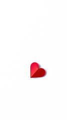 single red paper heart on a white background