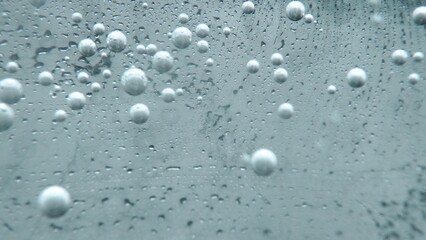 Macrography, witness the mesmerizing allure of a margarita bubble delicately adorned with a slice of lime, set against a bold black background. Each close-up shot of cocktail with lime. Comestible.