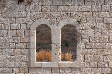 Window in an old wall. Window in an old wall. Remains of a fortress Migdal Tsedek, combining buildings from the Crusader and Ottoman periods