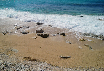 shallow waves on the beach. a mediterranean motif