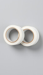 Fototapeta premium Two white unrolled duct tapes mockup on a grey background isolated with white highlights, png