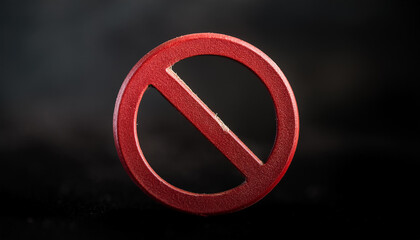 Red forbidden sign, ink stamp isolated on dark backdrop. No symbol.