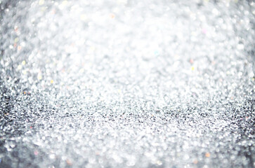 Argentic shimmering surface Shining glitter silver background New year Birthday Glowing texture  wedding Christmas template Glowing Copy space Holiday surface Defocused bokeh Shimmering texture