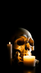 human skull illuminated by candles