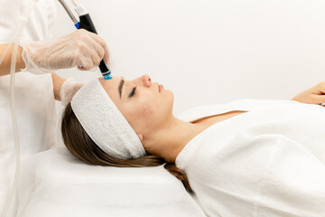 Professional cosmetology. A smart, qualified cosmetologist uses modern equipment to perform the...