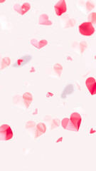 pink red paper hearts scattered on a light background
