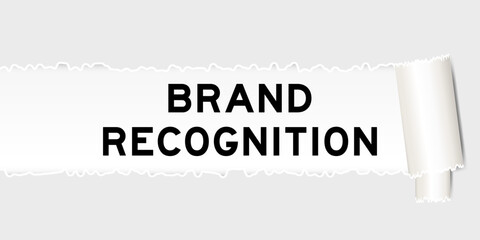 Ripped gray paper background that have word brand recognition under torn part