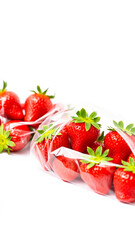 fresh red strawberries a clear bag