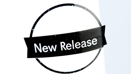 black white circle with a new release banner