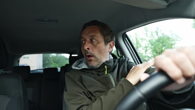 Concerned and worried driver in a car after small traffic accident, 4K slow motion