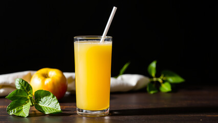 Fototapeta premium glass golden juice with an leaves
